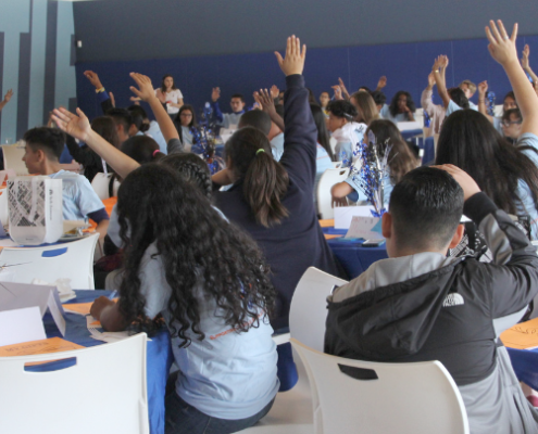 leadershipAcademy Kids with hands raised at leadership academy