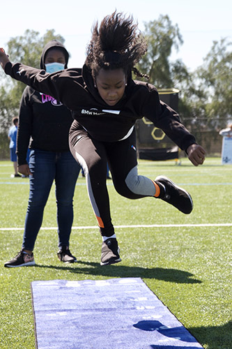 scienceOfSport Athlete doing broad jump